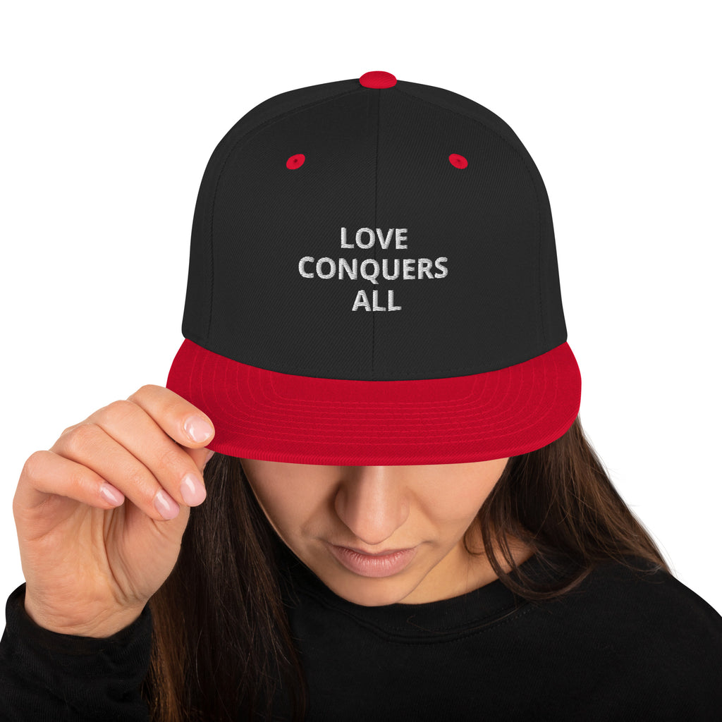“Love conquers” Snapback Hat