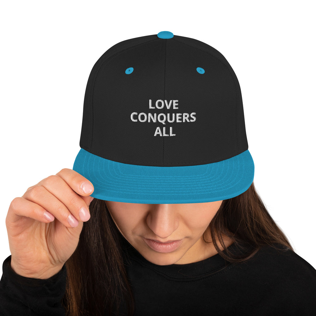 “Love conquers” Snapback Hat