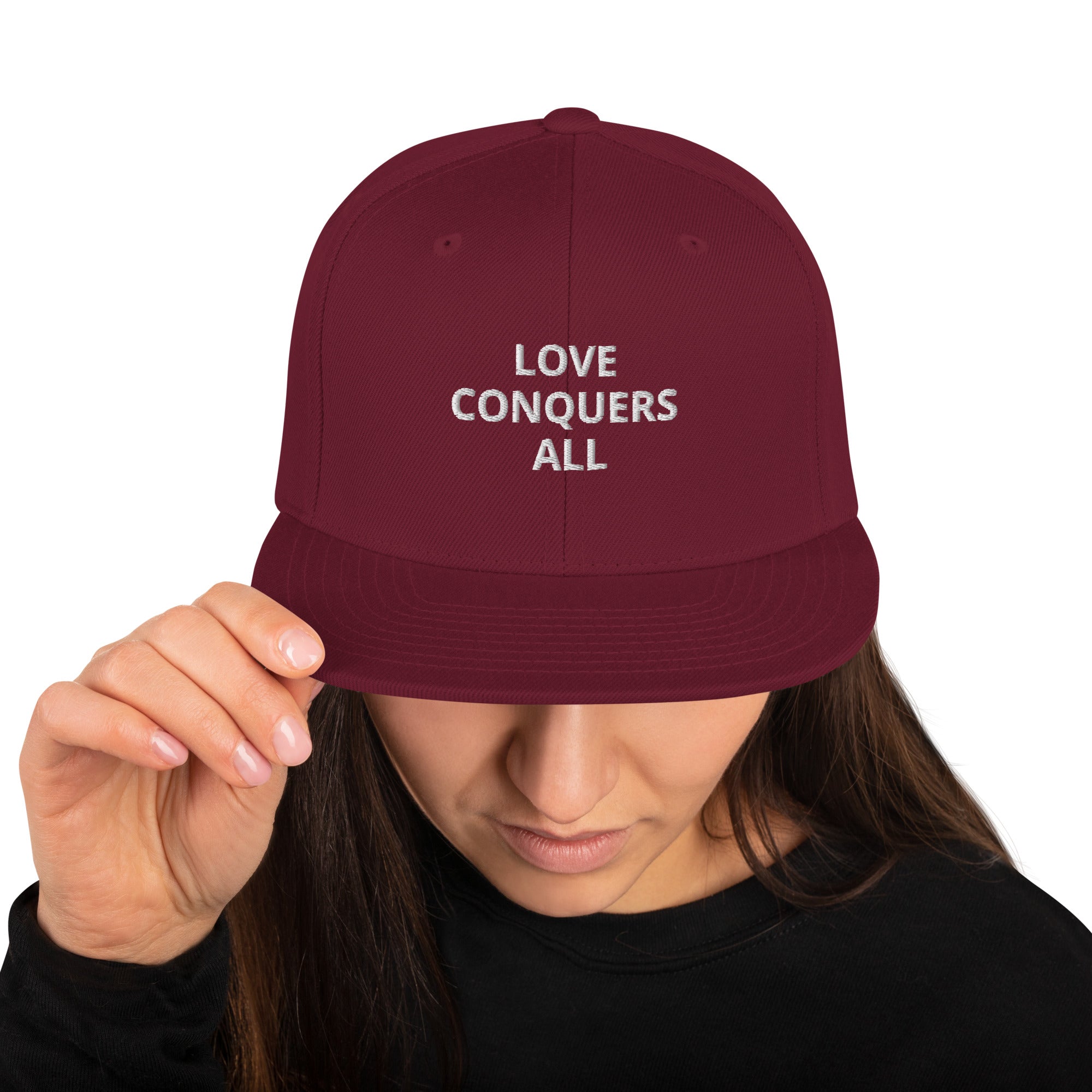 “Love conquers” Snapback Hat