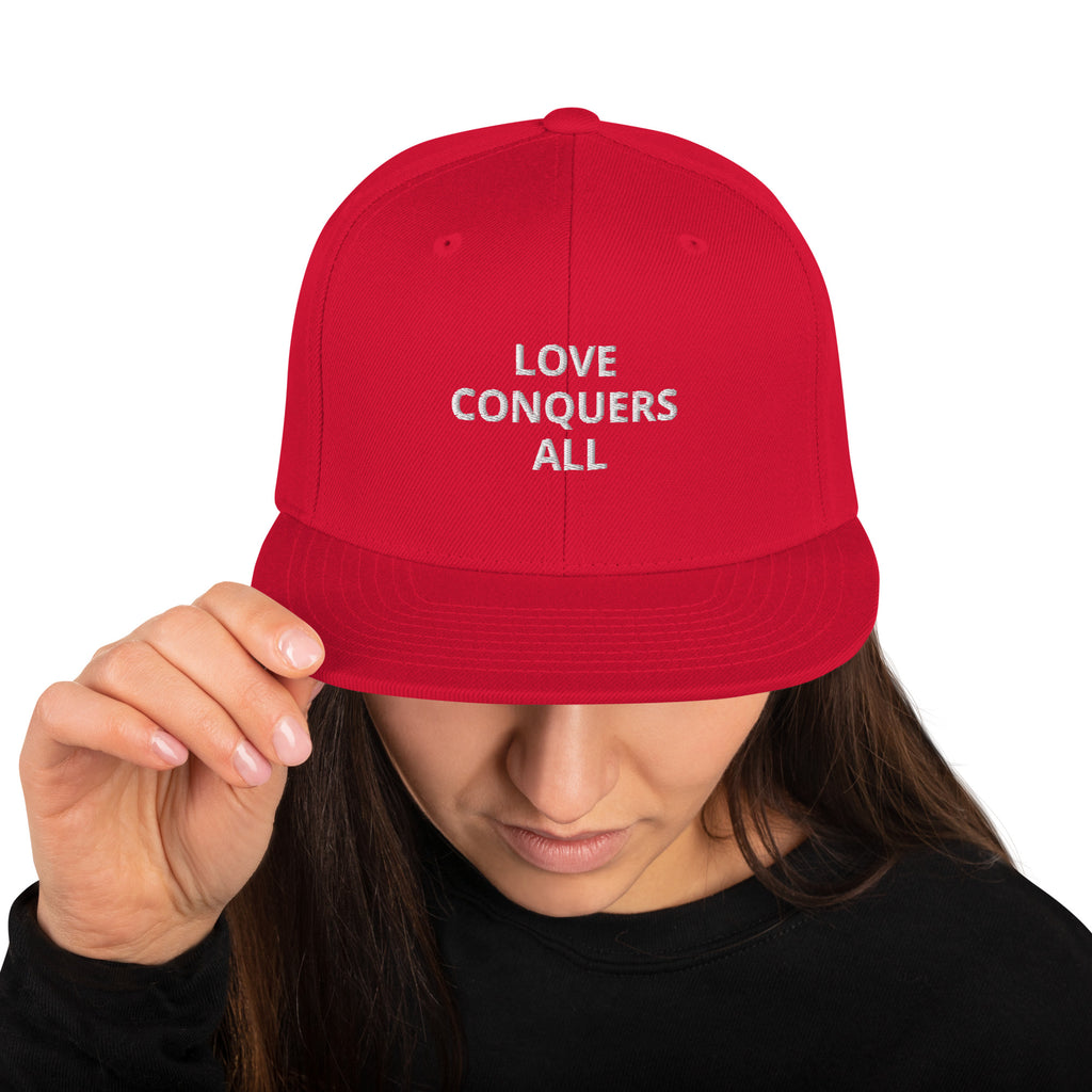 “Love conquers” Snapback Hat